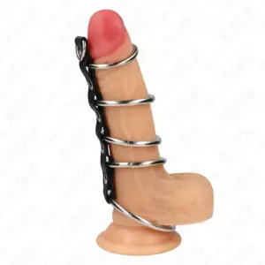 KINK - Anillos pene metálicos conectados por polipiel para control y placer.